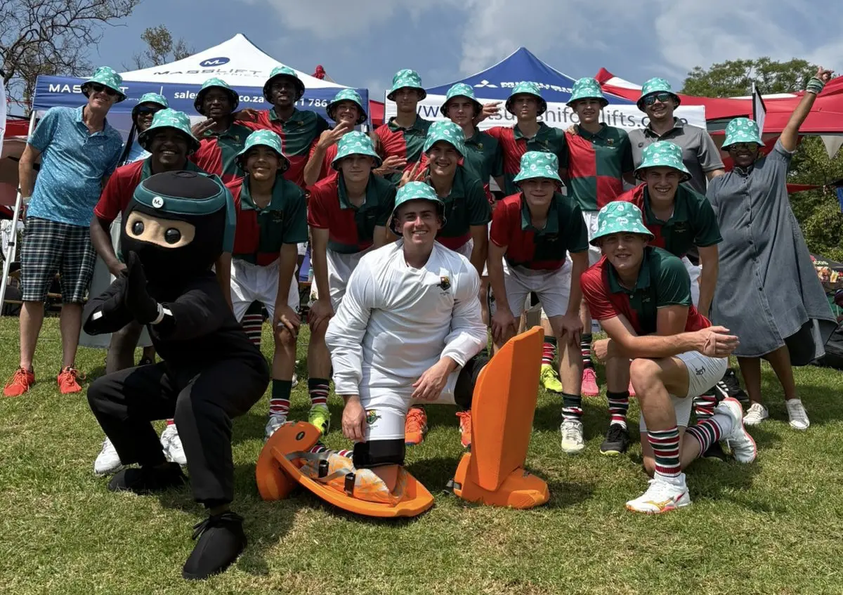Youth hockey team with coaches and the Masslift Ninja mascot at a Masslift Africa event